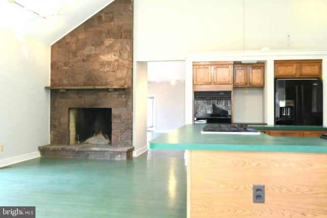 71 Fox Creek Ln, Woodville, VA 22749 - kitchen with baseboards, brown cabinets, black appliances, wood finished floors, and high vaulted ceiling