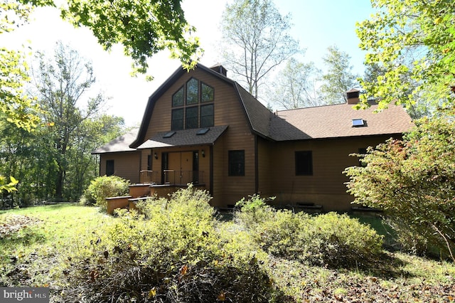71 Fox Creek Ln, Woodville, VA 22749 - back of property featuring a gambrel roof, a shingled roof, and a chimney