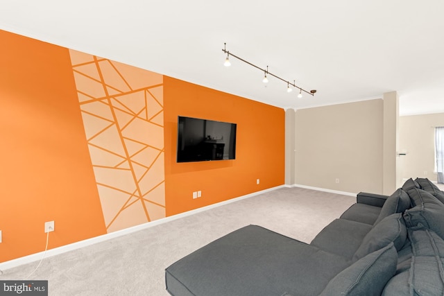 carpeted living room featuring rail lighting