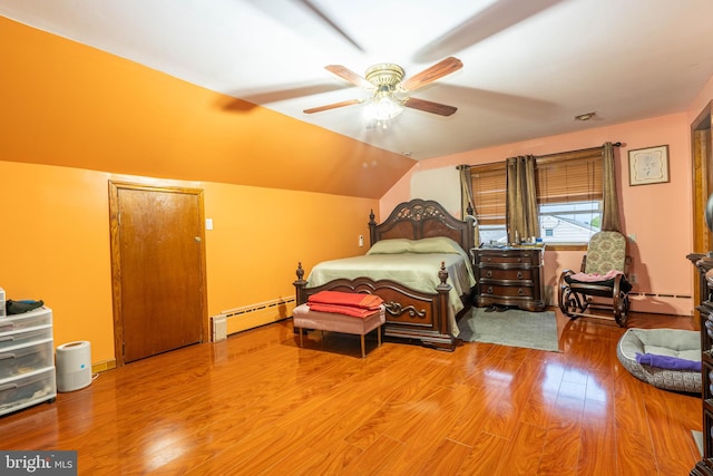 bedroom with ceiling fan, vaulted ceiling, hardwood / wood-style floors, and a baseboard heating unit