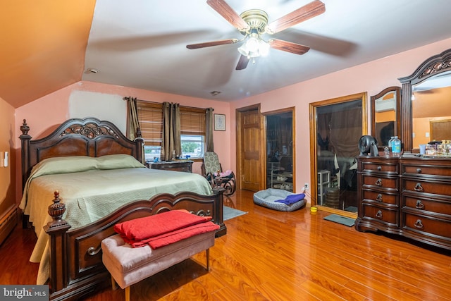 bedroom featuring ceiling fan, vaulted ceiling, and hardwood / wood-style floors