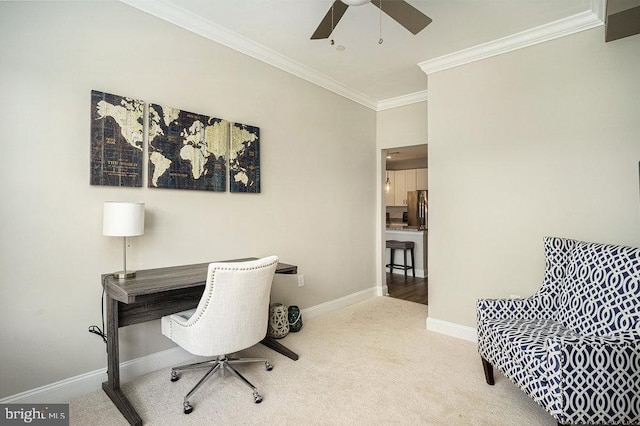 office with ornamental molding, carpet flooring, and ceiling fan