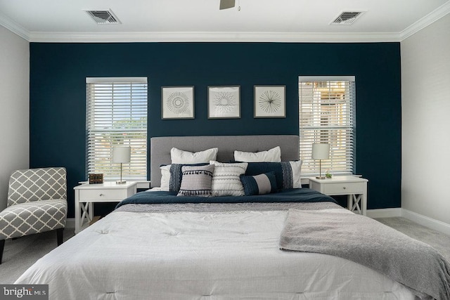 bedroom featuring carpet, ornamental molding, and multiple windows