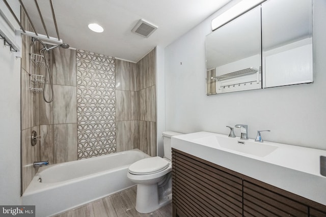 full bathroom with toilet, visible vents, vanity, shower / washtub combination, and wood finished floors
