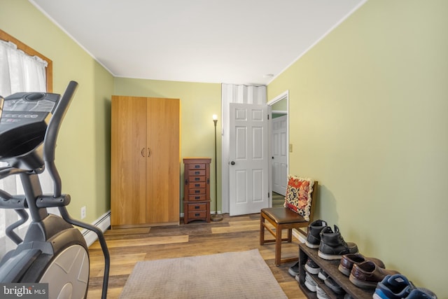 living area featuring light hardwood / wood-style flooring and baseboard heating