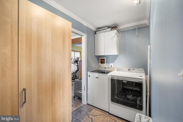 laundry room featuring dark hardwood / wood-style flooring, crown molding, separate washer and dryer, and cabinets