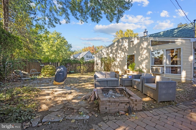 view of patio / terrace featuring an outdoor living space with a fire pit