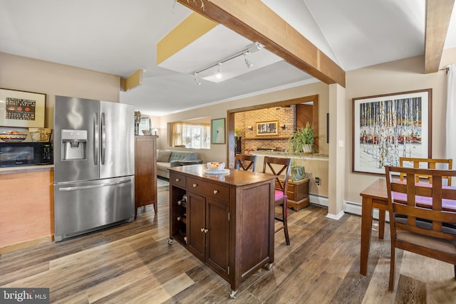 kitchen with stainless steel fridge, track lighting, dark brown cabinets, wood-type flooring, and ornamental molding