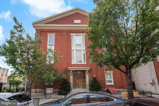 view of front of house with fence