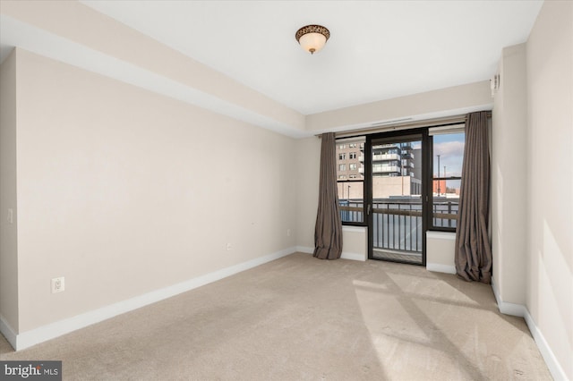 unfurnished room with light colored carpet