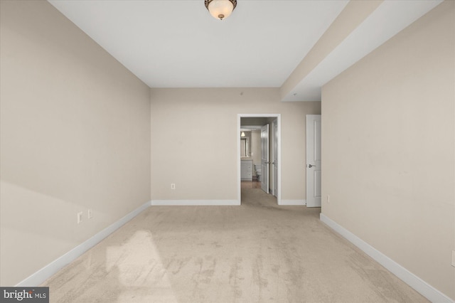 spare room with light colored carpet