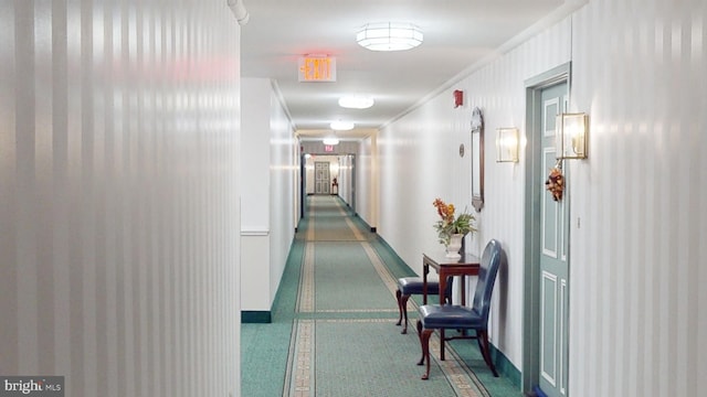 corridor featuring crown molding