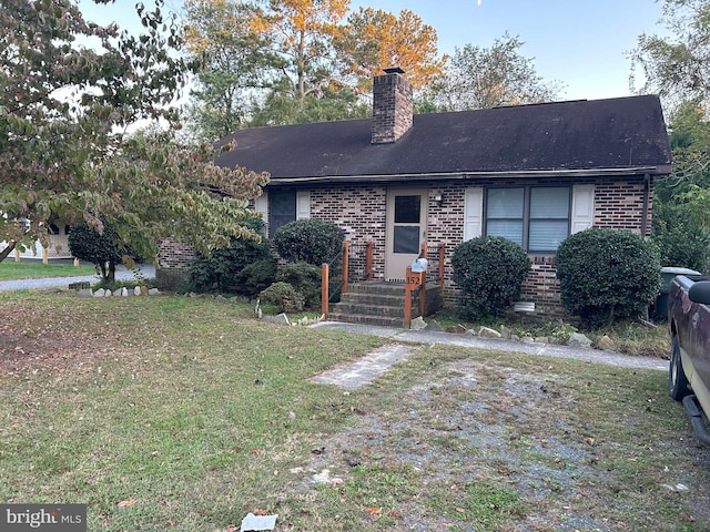 ranch-style house with a front lawn