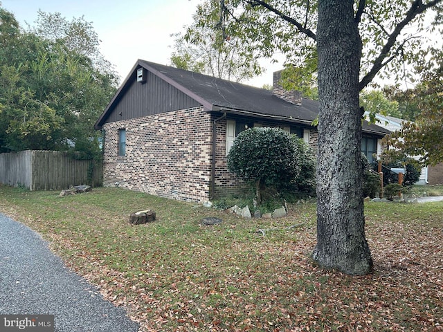 view of home's exterior with a lawn