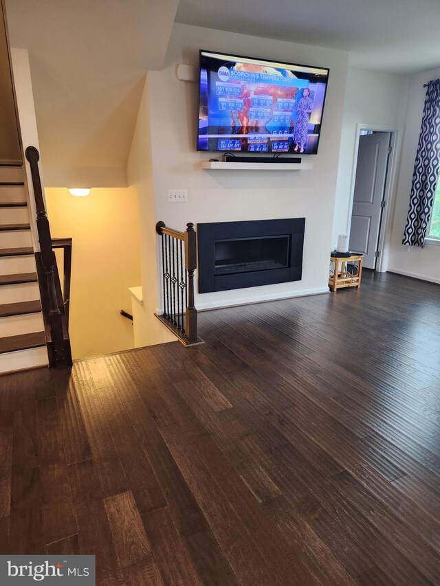 unfurnished living room with hardwood / wood-style floors