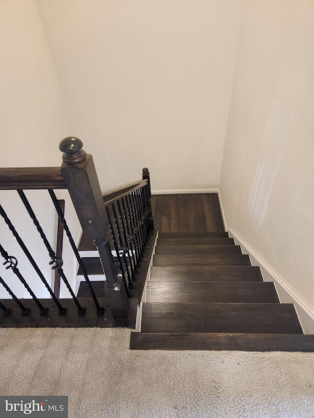 stairs with wood-type flooring