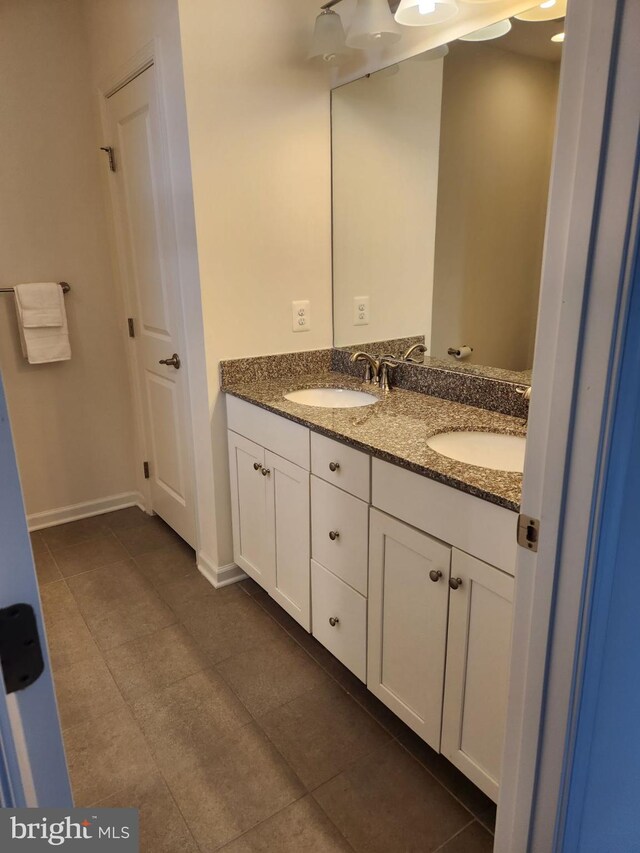 bathroom featuring vanity and tile patterned flooring