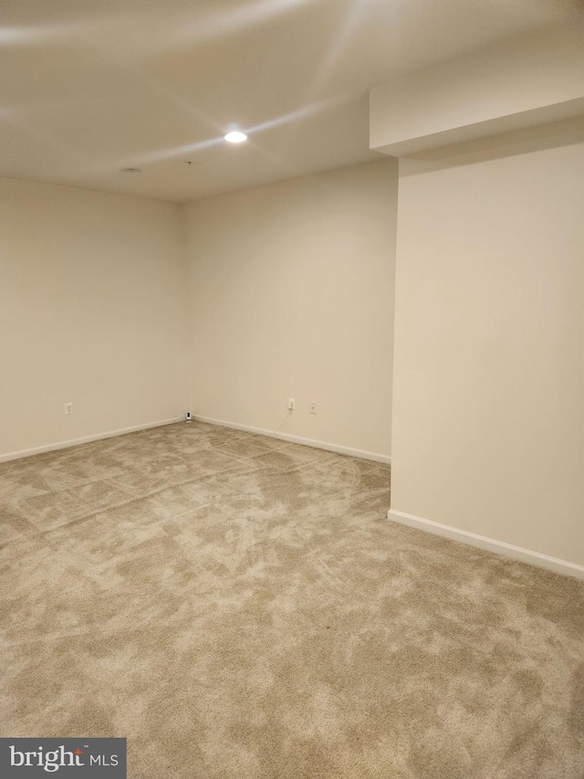 empty room featuring carpet flooring