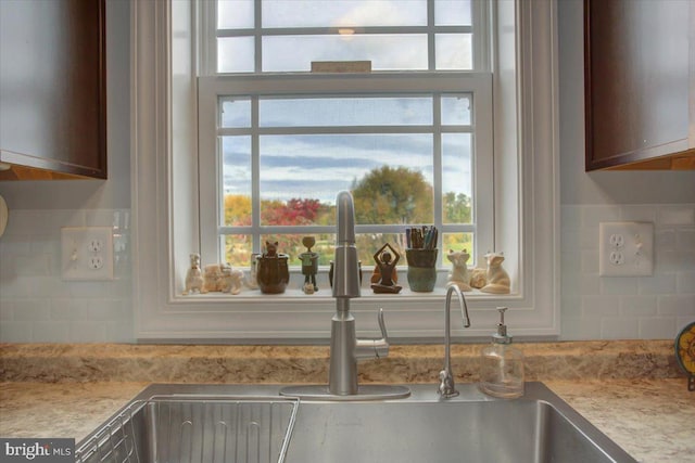 details with sink and decorative backsplash