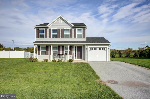 view of front of home with a garage, a porch, and a front lawn