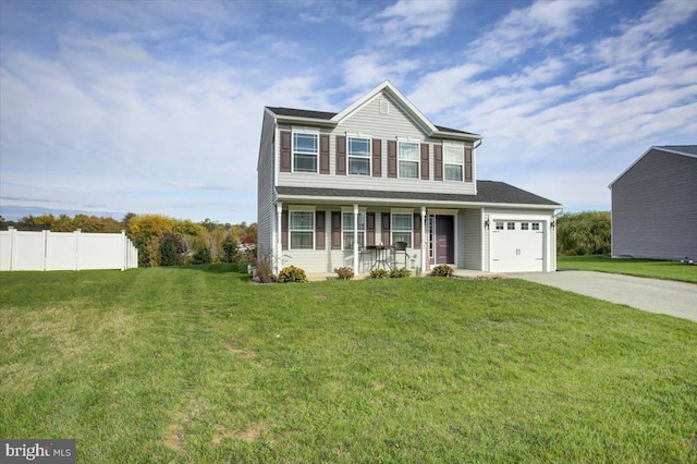 view of front of house with covered porch, a front yard, and a garage