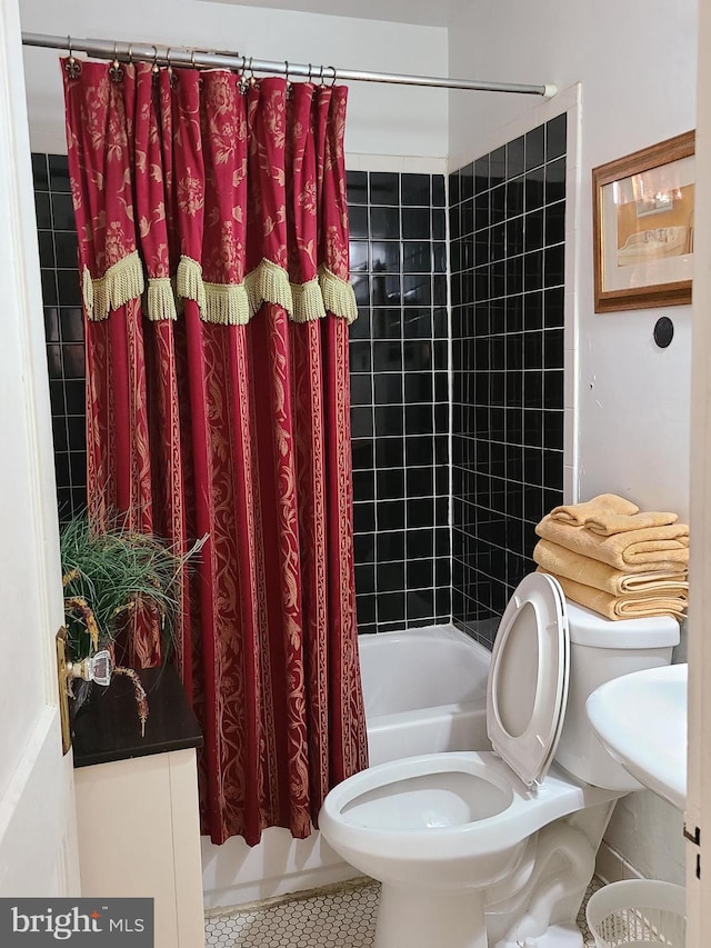 bathroom with shower / tub combo, toilet, and tile patterned floors