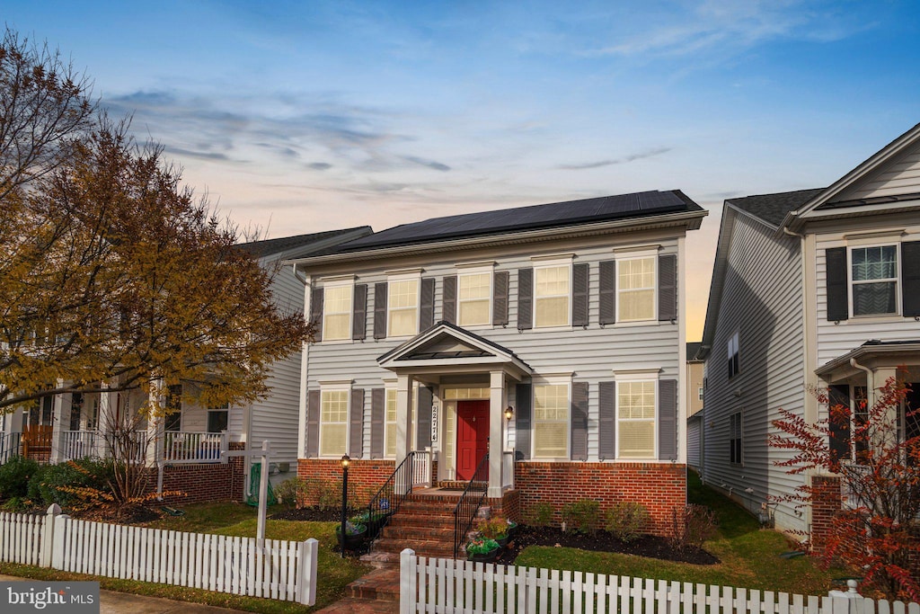 view of front of home featuring solar panels