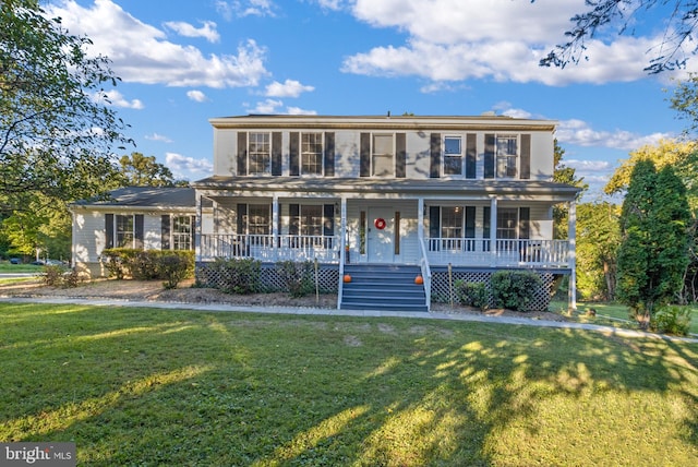 view of front of property featuring a porch and a front lawn