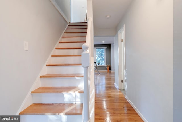 stairs with wood-type flooring