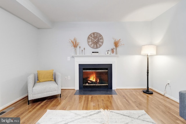 sitting room featuring hardwood / wood-style floors