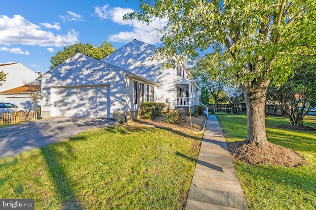 view of front of house with a front lawn and a garage