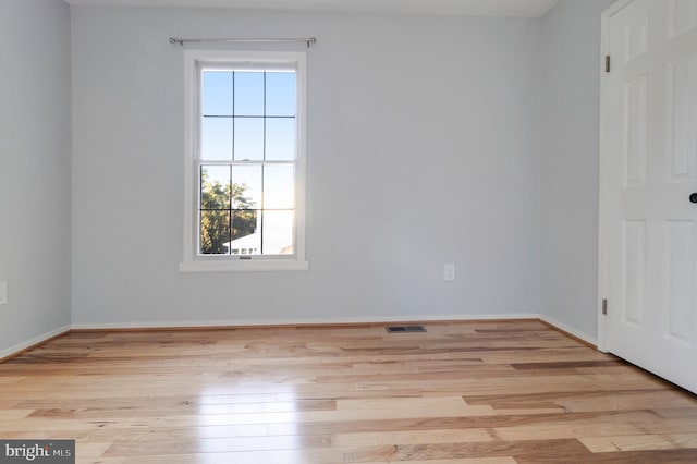 empty room with light wood-type flooring