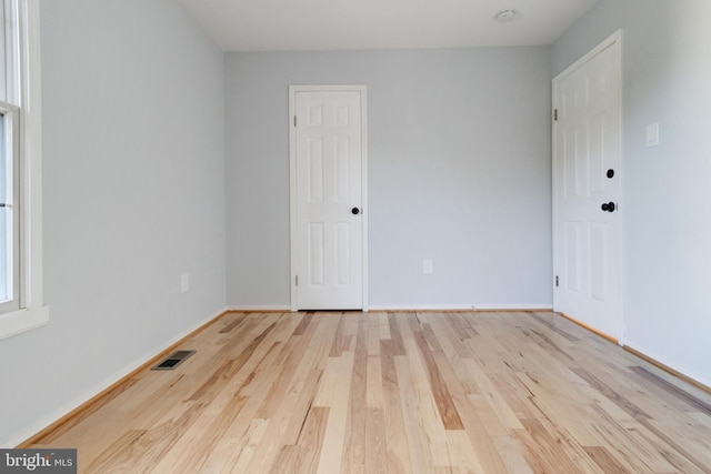 empty room featuring light hardwood / wood-style floors