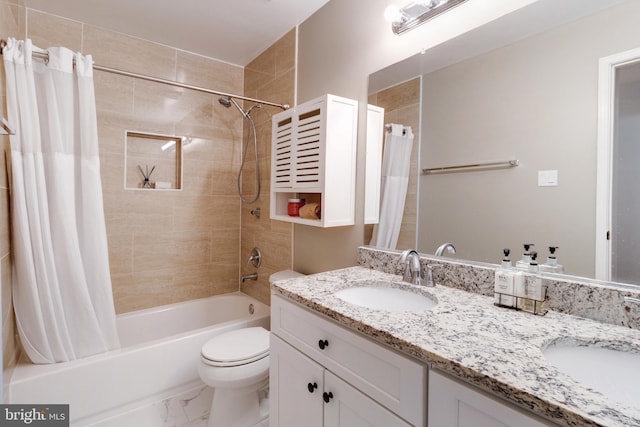 full bathroom with vanity, shower / bath combo with shower curtain, and toilet