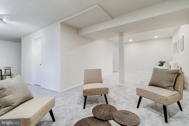 sitting room with light colored carpet