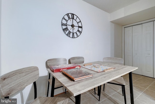 dining area with light tile patterned floors