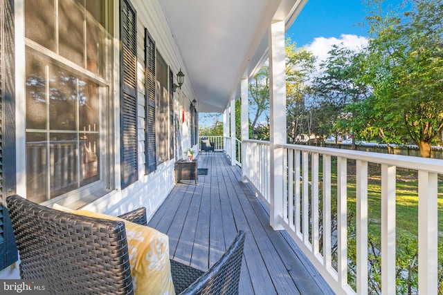 wooden deck featuring covered porch