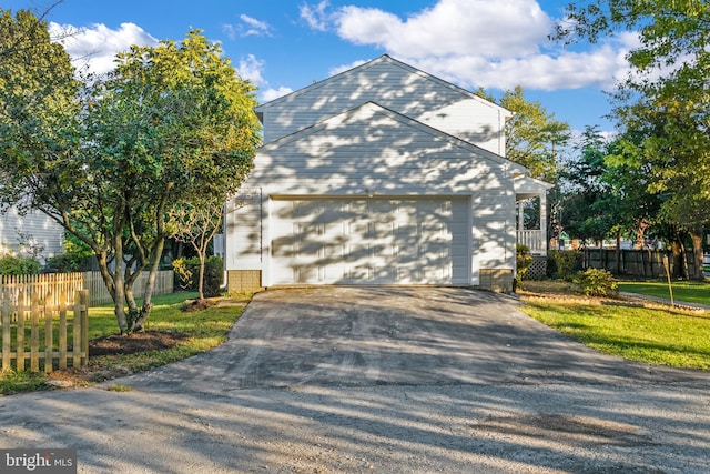 view of side of property with a garage