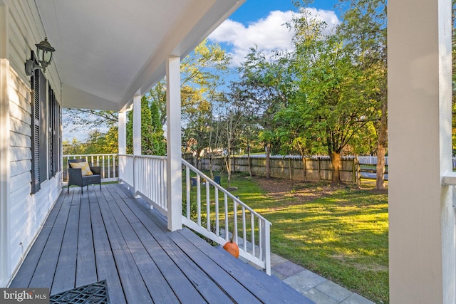 wooden terrace with a yard