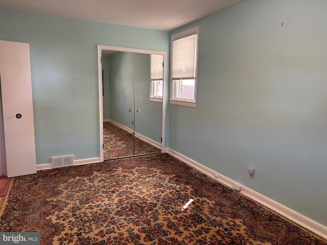 unfurnished bedroom featuring a closet