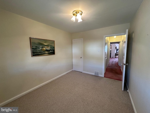 unfurnished bedroom with carpet