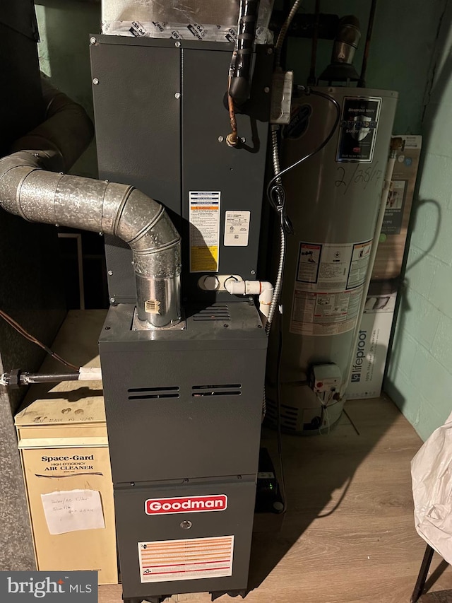 utility room featuring gas water heater