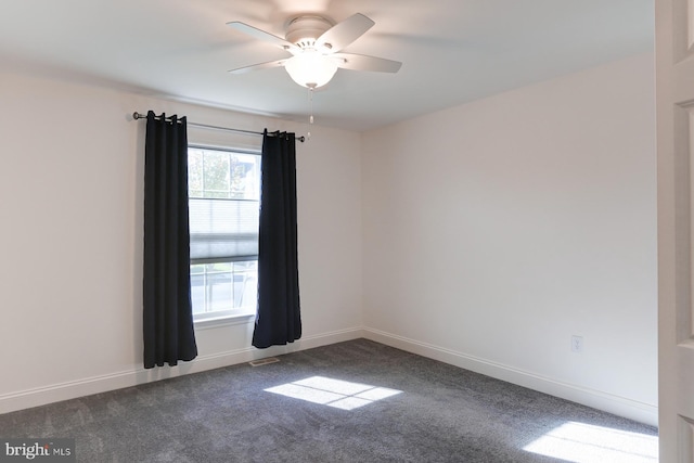 carpeted empty room featuring plenty of natural light and ceiling fan