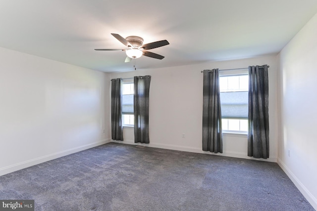 carpeted empty room featuring ceiling fan