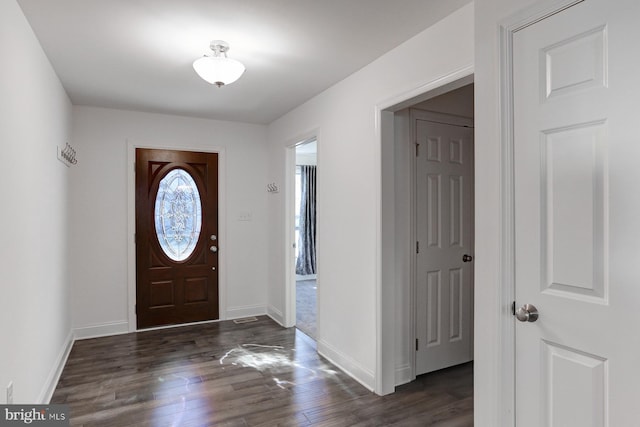 foyer with dark hardwood / wood-style floors