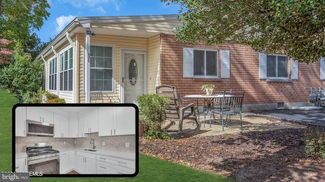 exterior space featuring a patio and sink