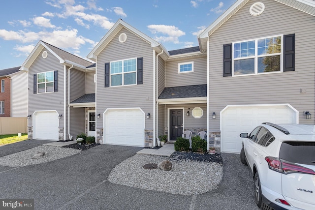 townhome / multi-family property featuring a garage