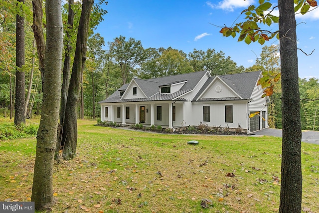 view of front of house featuring a front yard and a porch