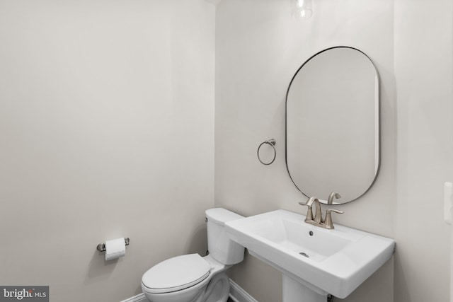 bathroom with toilet and sink