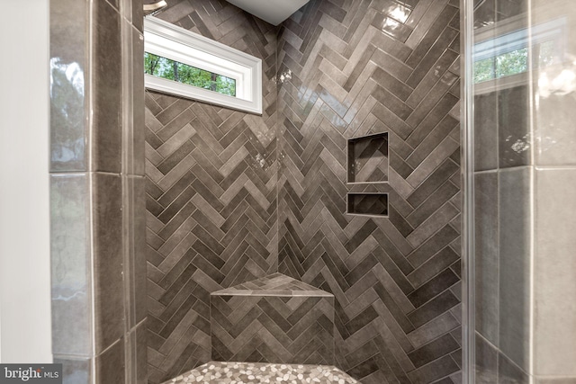 bathroom featuring a tile shower